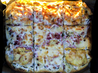 a baking tray with fresh, hot onioncake