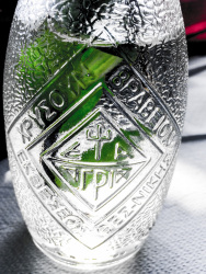a beautiful glassbottle with refreshing cold water inside