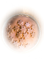 a marzipan cake decorated with marzipan stars on it