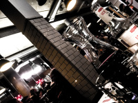 a carafe of red wine in a busy restaurant