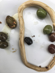 various green, black and brown olives with an italian taralli