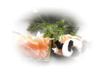 canapes with salmon, shrimps and caviar next to a green dill sprig
