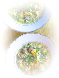 two gold rimmed plates are filled with typical german wedding soup