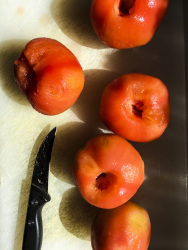 peeled tomates ready to cut in little peaces for prepairing greek stifado