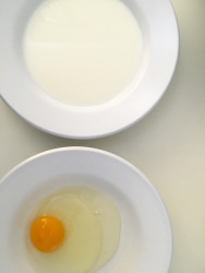 first part of preparing french toast with milk and egg
