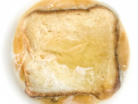 second part of preparing french toast with egg, milk and toast