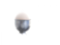 a boiled egg in a silver eggcup in a white shiny light