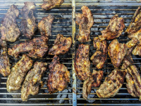 a grill full of ready grilled meat in a yummy color