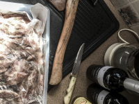 when greeks preparating meat for the grill they need inter alia a knife, wine and an axe