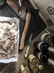 when greeks preparating meat for the grill they need inter alia a knife, wine and an axe