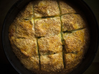 a round greek zucchini and feta pie with sesame on the top