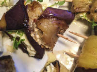 little eggplant skewers filled with feta and cress on the top