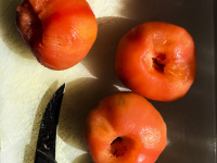 peeled tomates ready to cut in little peaces for prepairing greek stifado