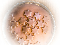 a marzipan cake decorated with marzipan stars on it