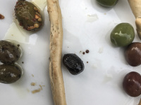 various green, black and brown olives with an italian taralli