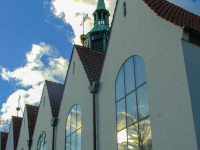 reflections in the big church windows of the st. peter paul church in hermansburg in lower saxony