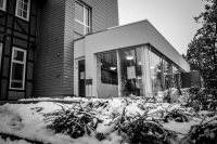 the entrance hall of the medical care center in hermannsburg in lower saxony in wintertime, black-and-white