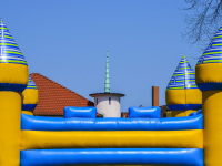 a colorful bouncy castle in front of a blue sky in bergen in lower saxony