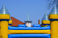 a colorful bouncy castle in front of a blue sky in bergen in lower saxony
