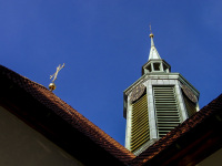 the tower of the st. peter paul church in hermannsburg in lower saxony under a blue sky
