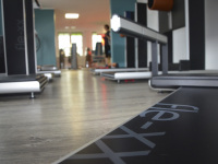 a fitness studio with fitness equipment in worm\'s eye view