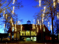 the city hall of hermannsburg in lower saxony is lit up for christmas at a nice evening light
