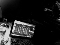 nightly working idyll with a macbook and retsina on a balkony in stegna on rhodes, black-and-white