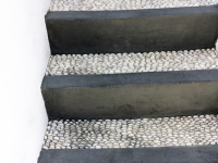 a grey stone stairs with pebble mosaik in lindos on rhodes