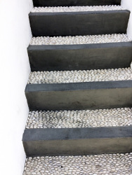 a grey stone stairs with pebble mosaik in lindos on rhodes