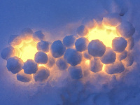by snowballs builded lanterns are shining in the snow