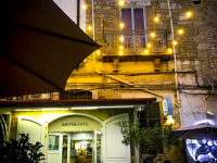 the nice illuminated outdoor area of the taverna del duca in bovino in puglia