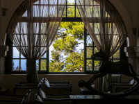 the lounge of the elafos hotel on rhodes with a view out of the window