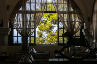 the lounge of the elafos hotel on rhodes with a view out of the window