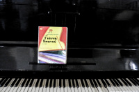 a black piano with a colorful song book ot the greek composer giannis spanos in the lounge of the hotel elafos on rhodes