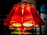 a unique lamp, builded by bottles of campari, in a italian restaurant in cologne