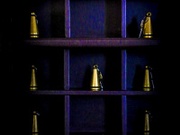 in a wooden purple key rack are golden colored keys for the rooms in the elafos hotel on rhodes