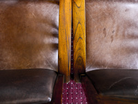 brown leather armchairs with wooden armrests in the elafos hotel on rhodes
