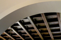 a round arch and a dark brown wooden ceiling in the lounge in the elafos hotel on rhodes