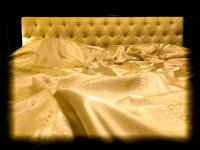 a dream of a bed with golden bedding in the residenza ducale in bovino in puglia