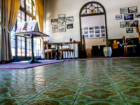 the entrance area of the elafos hotel on rhodes with a  green tiled floor