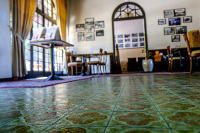 the entrance area of the elafos hotel on rhodes with a  green tiled floor