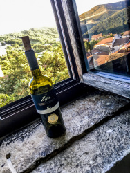 a bottle primitivo di manduria at the window in the residenza ducale in bovino in puglia