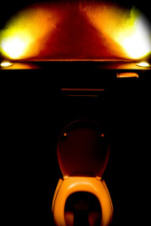 a spooky illuminated toilet on the lycabettus hill in athens