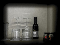 glasses, a small bottle of trollinger wein and snacks in a room of the hotel nh collection köln mediapark in cologne