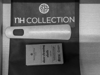 a shoehorn and a shoe cleaning cloth in a room of the hotel nh collection köln mediapark in cologne, black-and-white