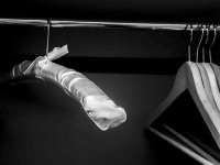 a little group of hanger in a wardrope in a room of the hotel nh collection köln mediapark in cologne, black-and-white