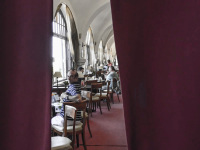 the lounge of the hotel elafos on rhodes behind a red velvet curtain
