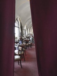 the lounge of the hotel elafos on rhodes behind a red velvet curtain