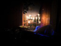 a sugarloaf is burning on a fire tongs for a punch