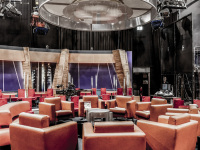 red and light brown armchairs are standing in a circle in a tv-studio in cologne mühlheim
